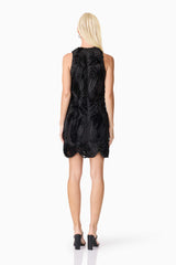Blonde model wearing Asher Mini Shift Dress in Black back shot