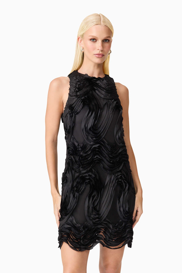 Blonde model wearing Asher Mini Shift Dress in Black close up shot