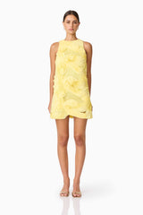 Brunette model wearing Asher Mini Shift Dress in Yellow front shot