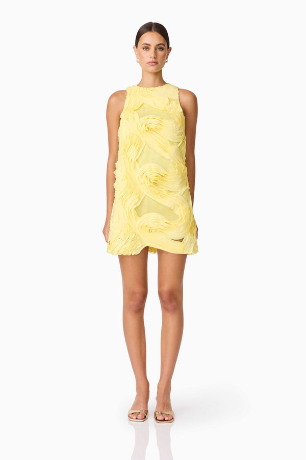 Brunette model wearing Asher Mini Shift Dress in Yellow front shot