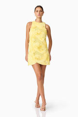 Brunette model wearing Asher Mini Shift Dress in Yellow front shot hand behind dress pose