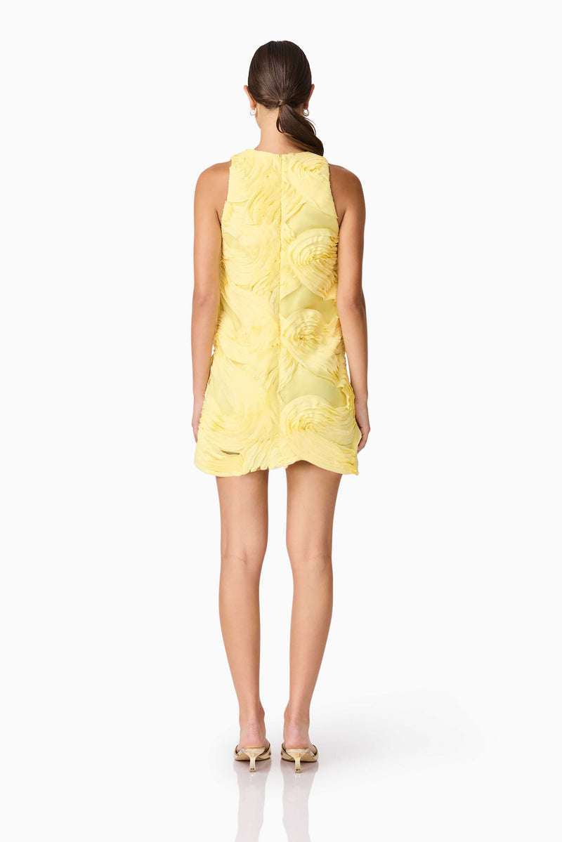 Brunette model wearing Asher Mini Shift Dress in Yellow back shot