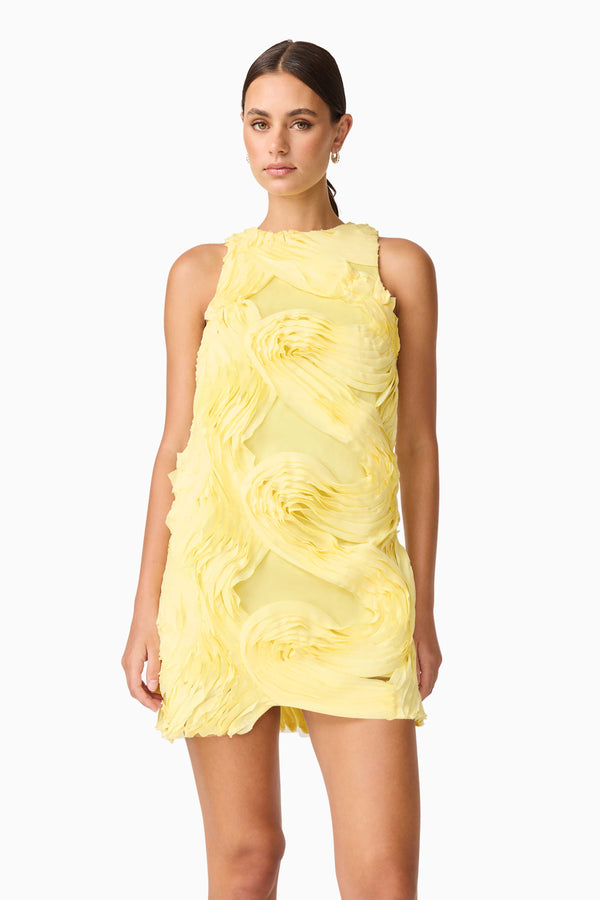 Brunette model wearing Asher Mini Shift Dress in Yellow close up shot