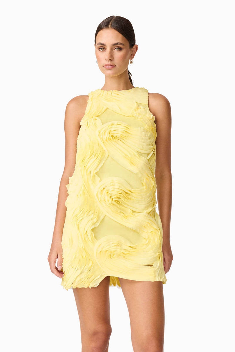 Brunette model wearing Asher Mini Shift Dress in Yellow close up shot