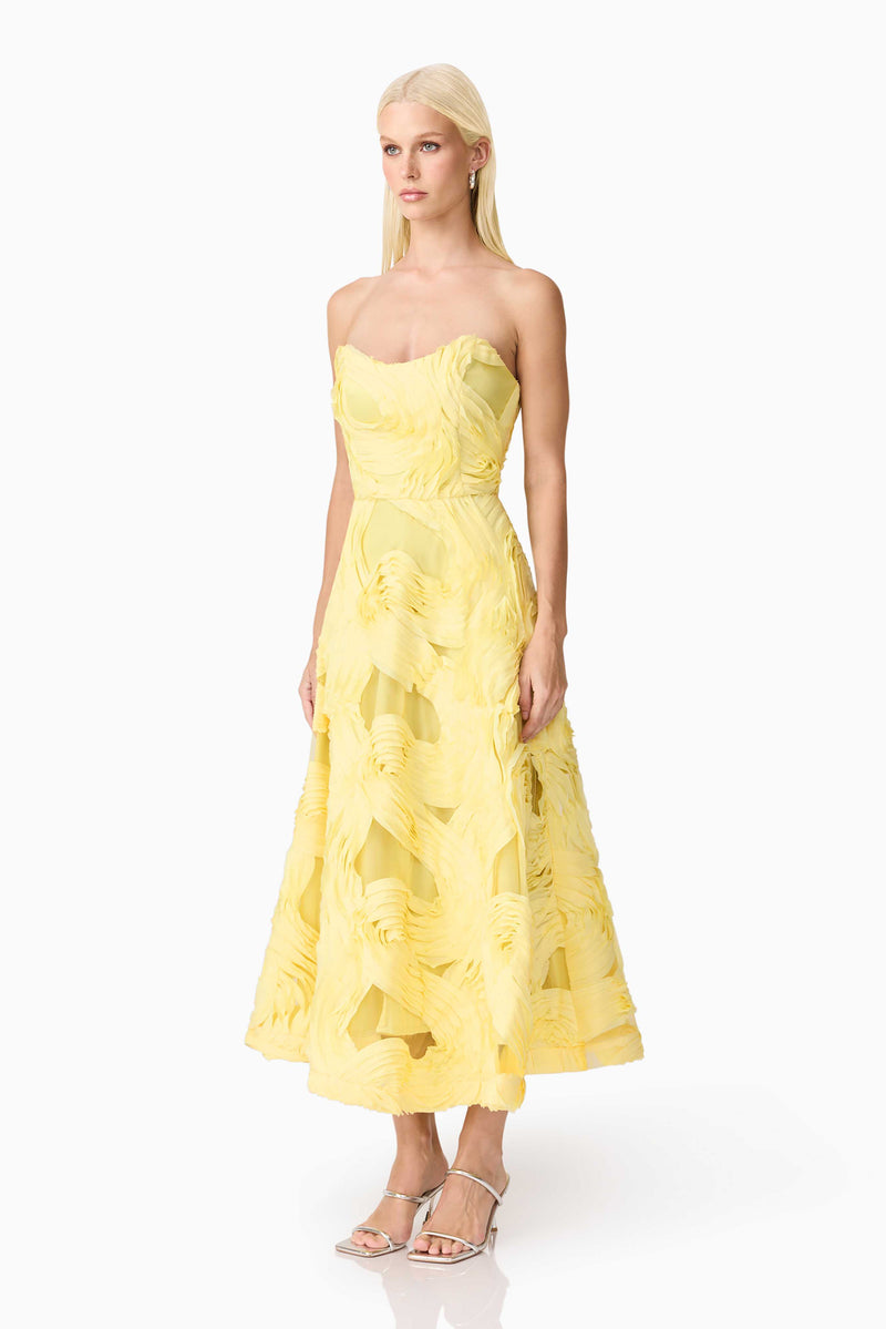 Blonde model wearing Asher Sweetheart Midi Dress in Yellow side shot