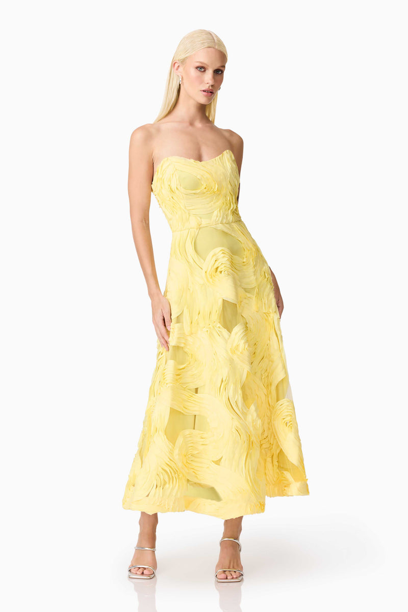 Blonde model wearing Asher Sweetheart Midi Dress in Yellow front shot posing with hands beside dress