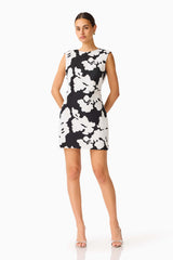 Bloomoir Shift Mini Dress in Black & White with a round neckline and sleeveless silhouette posed shot