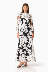Bloomnoir Long Sleeve Maxi Dress in Black & White with a high neckline, sheer long sleeves & fit & flare fit posed shot