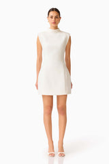 Elysia Lace Mini Dress in White with high collar neckline & tulip silhouette front shot