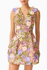 Fiora Mini Tulip Dress in Green Multi closeup shot showing the rose-pink and purple 3D floral fabrications