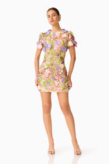 Fiora Shift Mini Dress in Green & Pink Floral with short sleeves & 3D floral embroidery posed hand on hip shot