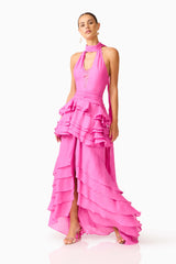 Rosera Halter Gown in Pink posed shot featuring a collared halter neckline and tier ruffle skirt detail