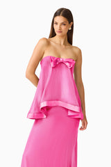 Rosera Satin Bow Maxi Dress in Pink close up shot featuring a strapless neckline and ribbon bow detail