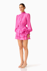 Rosera Long Sleeve Playsuit in Pink with a tiered skirt and long balloon sleeves side shot