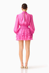 Rosera Long Sleeve Playsuit in Pink with a tiered skirt and back keyhole back shot