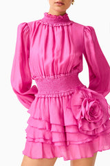 Rosera Long Sleeve Playsuit in Pink with a tiered skirt and long balloon sleeves detail shot
