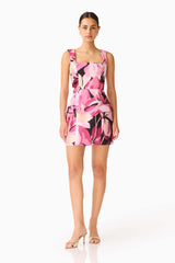 Lumiflora A-Line Mini Dress in Pink Floral with printed jacquard fabrication & flap pockets posed shot