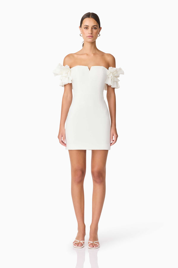 Brunette model wearing Nola Off The Shoulder Mini Dress in White front shot