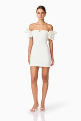 Brunette model wearing Nola Off The Shoulder Mini Dress in White posed shot