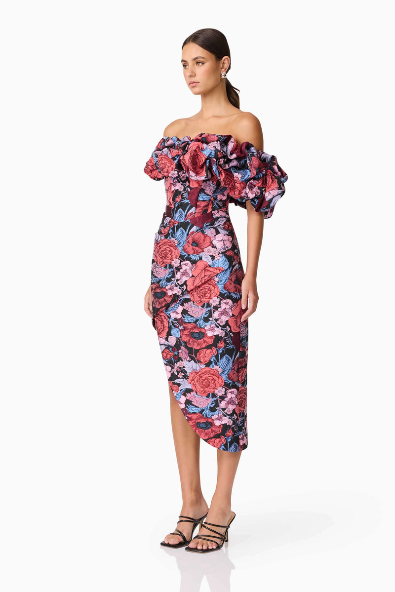 Brunette model wearing Delphine Off The Shoulder Midi Dress in Pink & Back Floral side shot