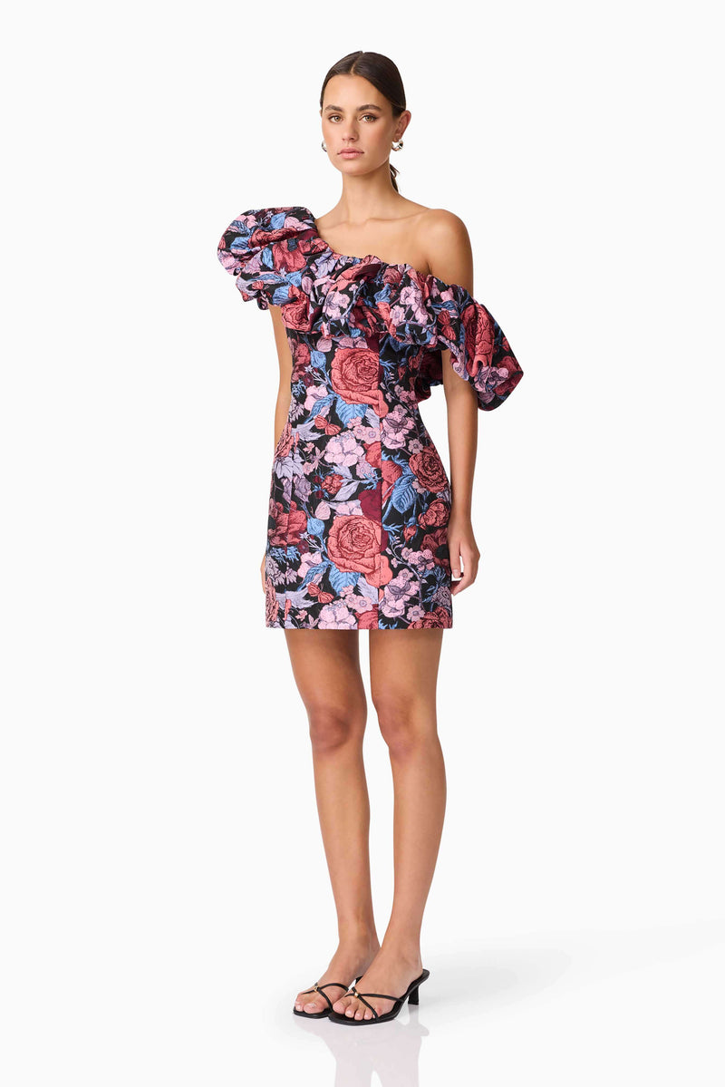 Brunette model wearing Delphine One Shoulder Mini Dress in Pink & Black Floral side shot