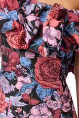 Brunette model wearing Delphine One Shoulder Mini Dress in Pink & Black Floral detail shot
