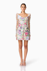 Brunette model wearing Eliska Long Sleeve Mini Dress in Floral front shot