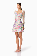 Brunette model wearing Eliska Long Sleeve Mini Dress in Floral side shot