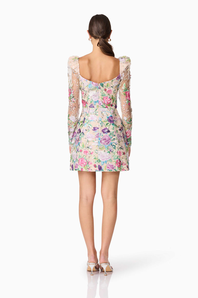 Brunette model wearing Eliska Long Sleeve Mini Dress in Floral back shot