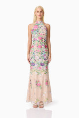 Blonde model wearing Eliska Halter Neck Gown in Floral front shot