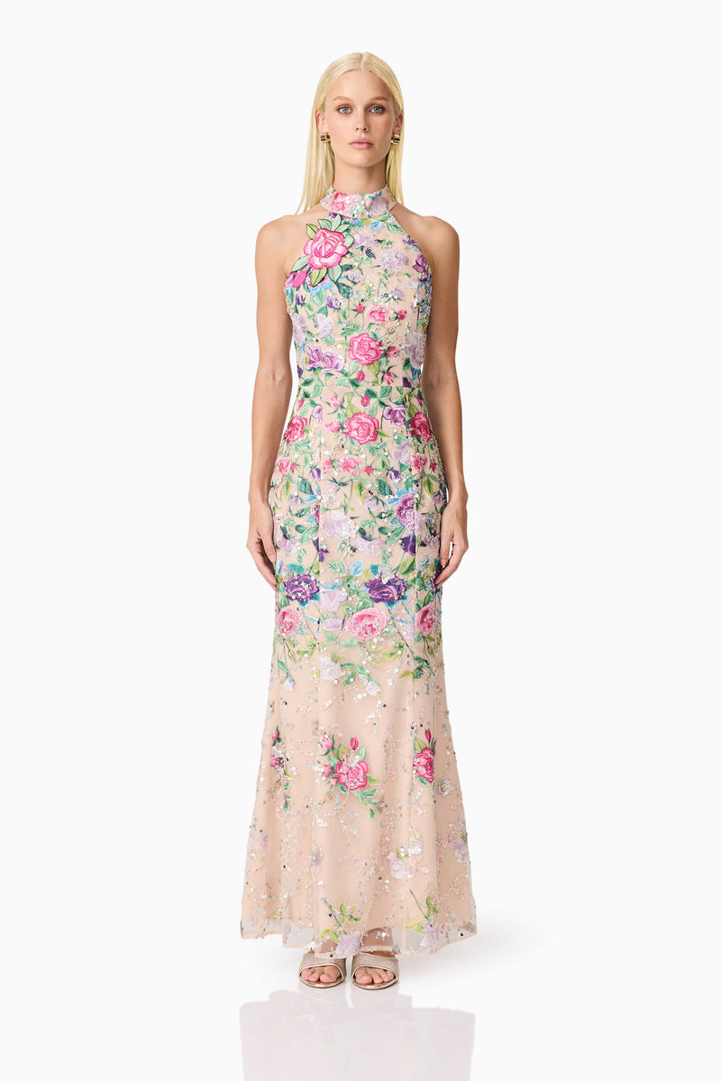 Blonde model wearing Eliska Halter Neck Gown in Floral front shot