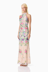 Blonde model wearing Eliska Halter Neck Gown in Floral side shot