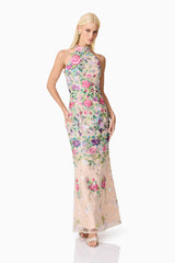 Blonde model wearing Eliska Halter Neck Gown in Floral posed shot