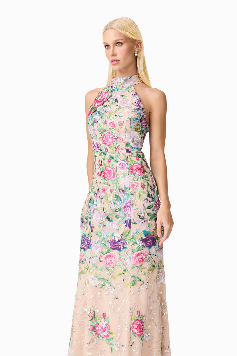 Blonde model wearing Eliska Halter Neck Gown in Floral close up shot