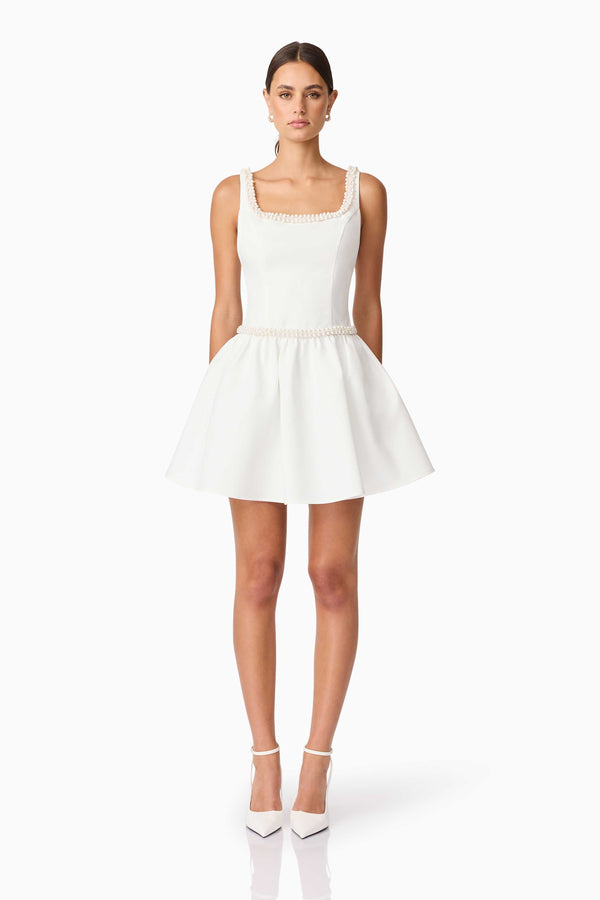 Brunette model wearing Rafaela A-Line Mini Dress in White front shot