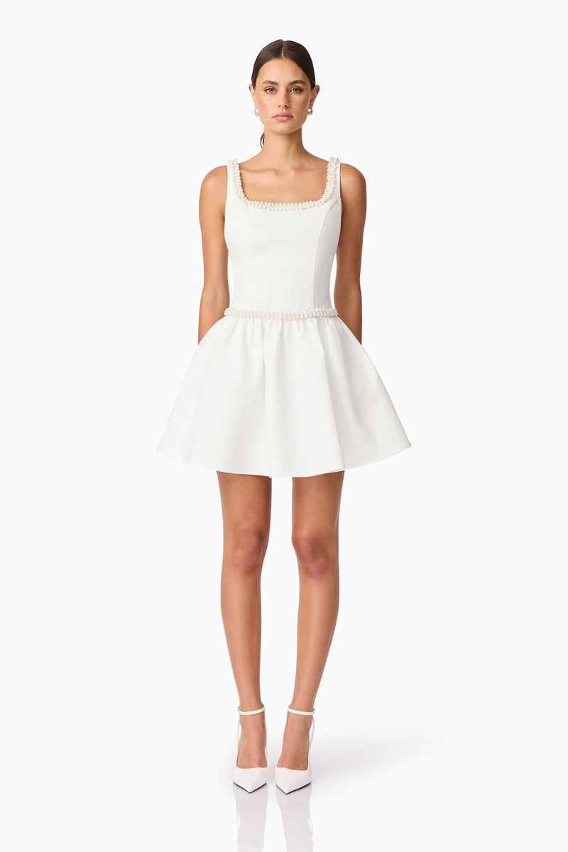 Brunette model wearing Rafaela A-Line Mini Dress in White front shot