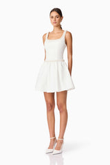 Brunette model wearing Rafaela A-Line Mini Dress in White side shot