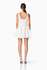 Brunette model wearing Rafaela A-Line Mini Dress in White back shot