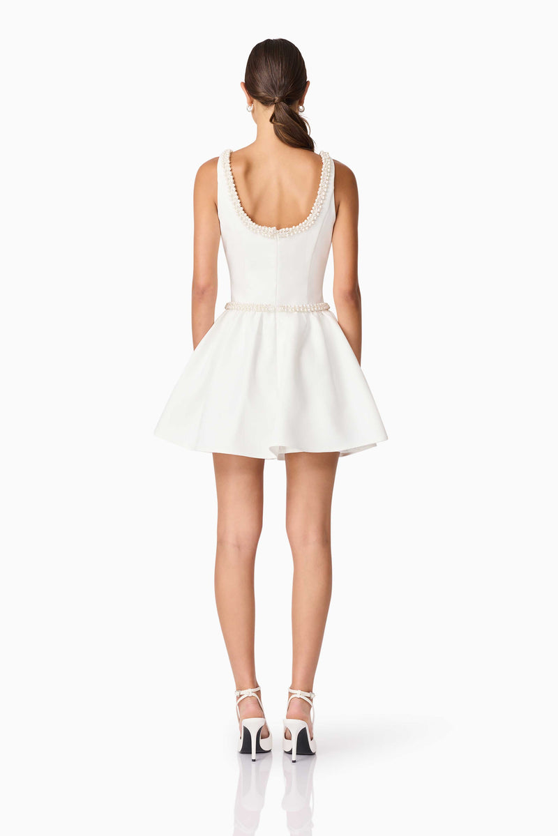 Brunette model wearing Rafaela A-Line Mini Dress in White back shot
