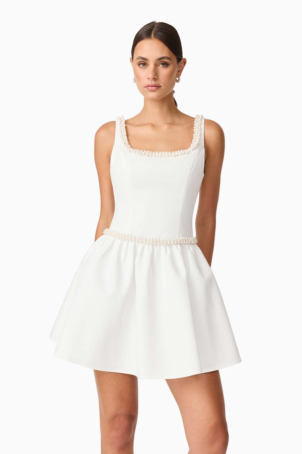 Brunette model wearing Rafaela A-Line Mini Dress in White close up shot