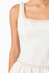 Brunette model wearing Rafaela A-Line Mini Dress in White detail shot