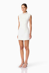 Blonde model wearing Rafaela Mini Shift Dress in White side shot