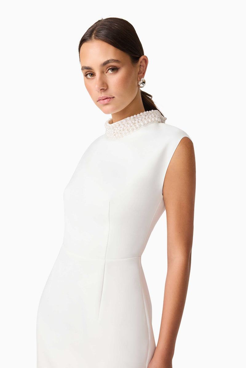 Blonde model wearing Rafaela Mini Shift Dress in White close up shot