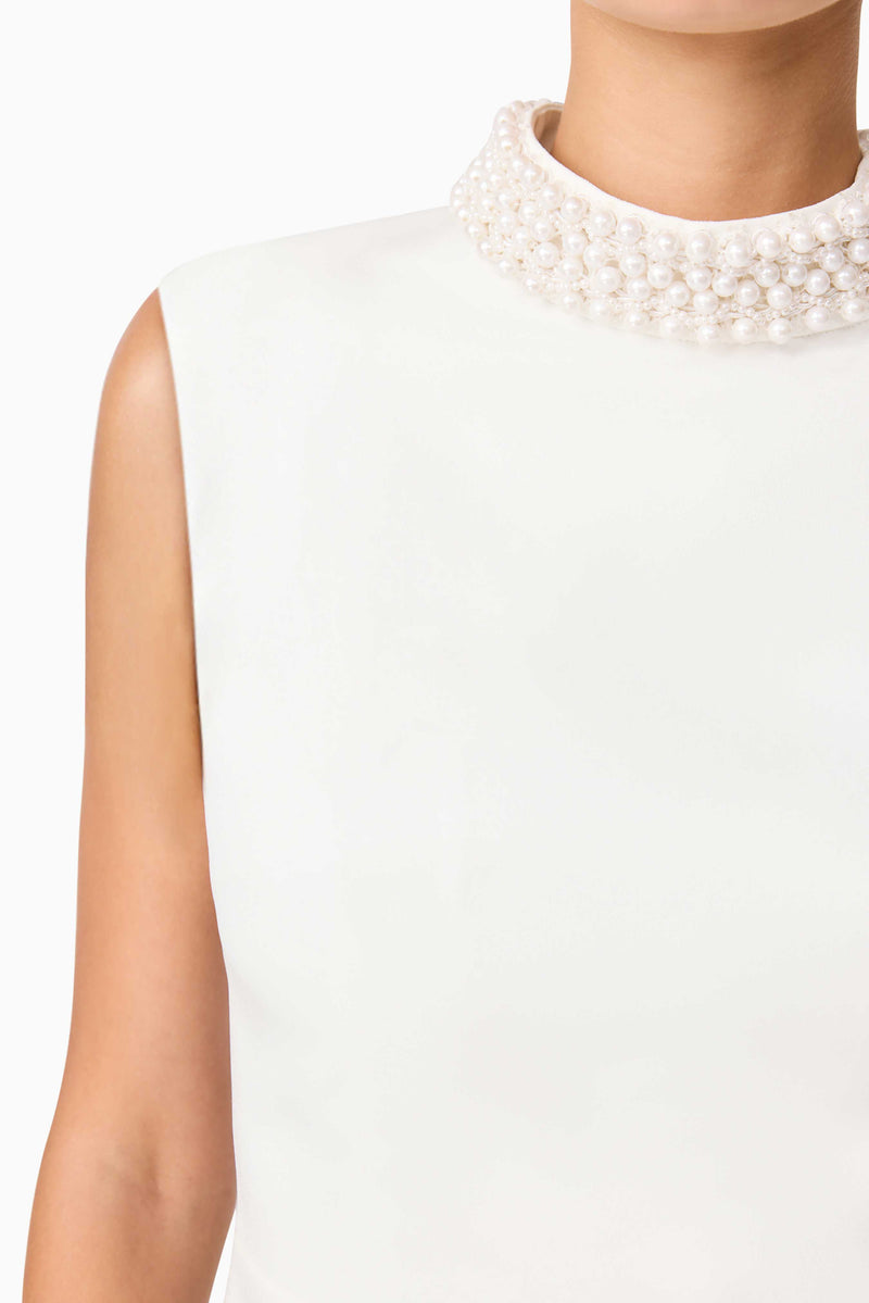 Blonde model wearing Rafaela Mini Shift Dress in White detail shot