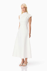 Brunette model wearing the Rafaela Midi Dress in White side shot