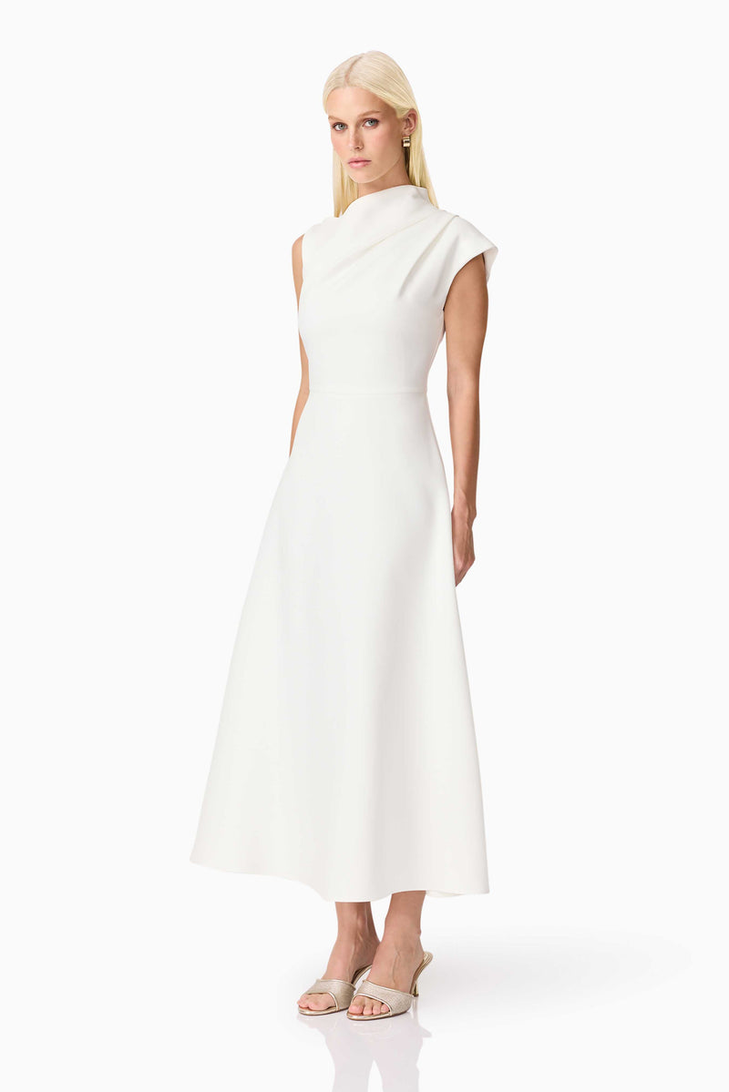 Brunette model wearing the Rafaela Midi Dress in White side shot