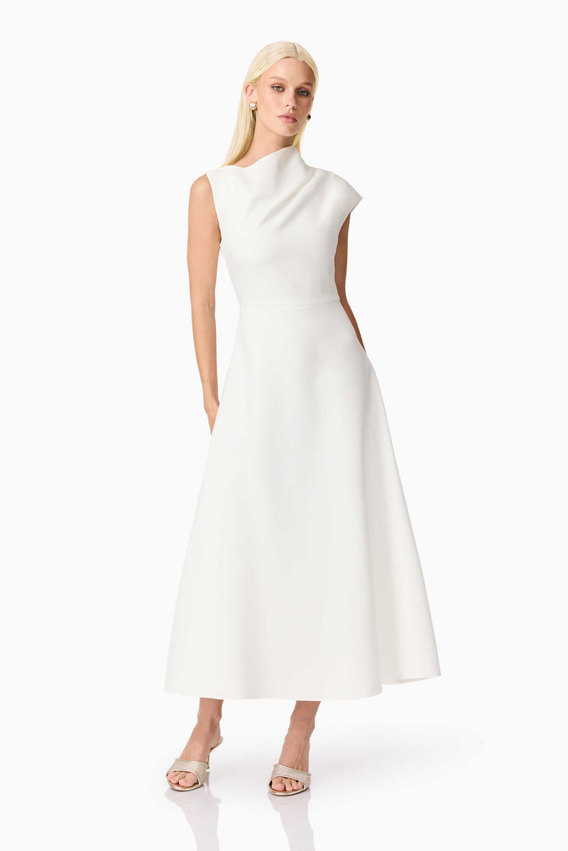 Brunette model wearing the Rafaela Midi Dress in White posed shot