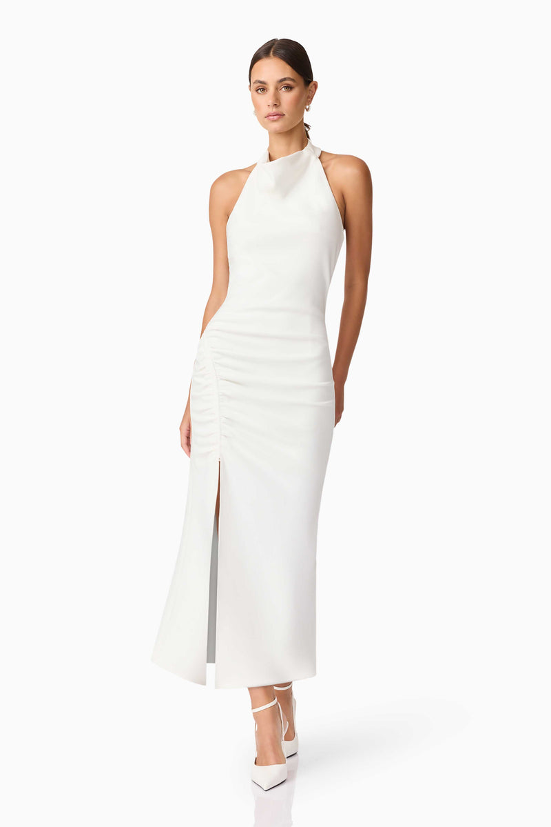 Brunette model wearing Nerissa Cowl Neck Maxi Dress in White posed shot