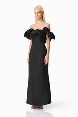Blonde model wearing Sharon Off The Shoulder Midi Dress in Black side shot