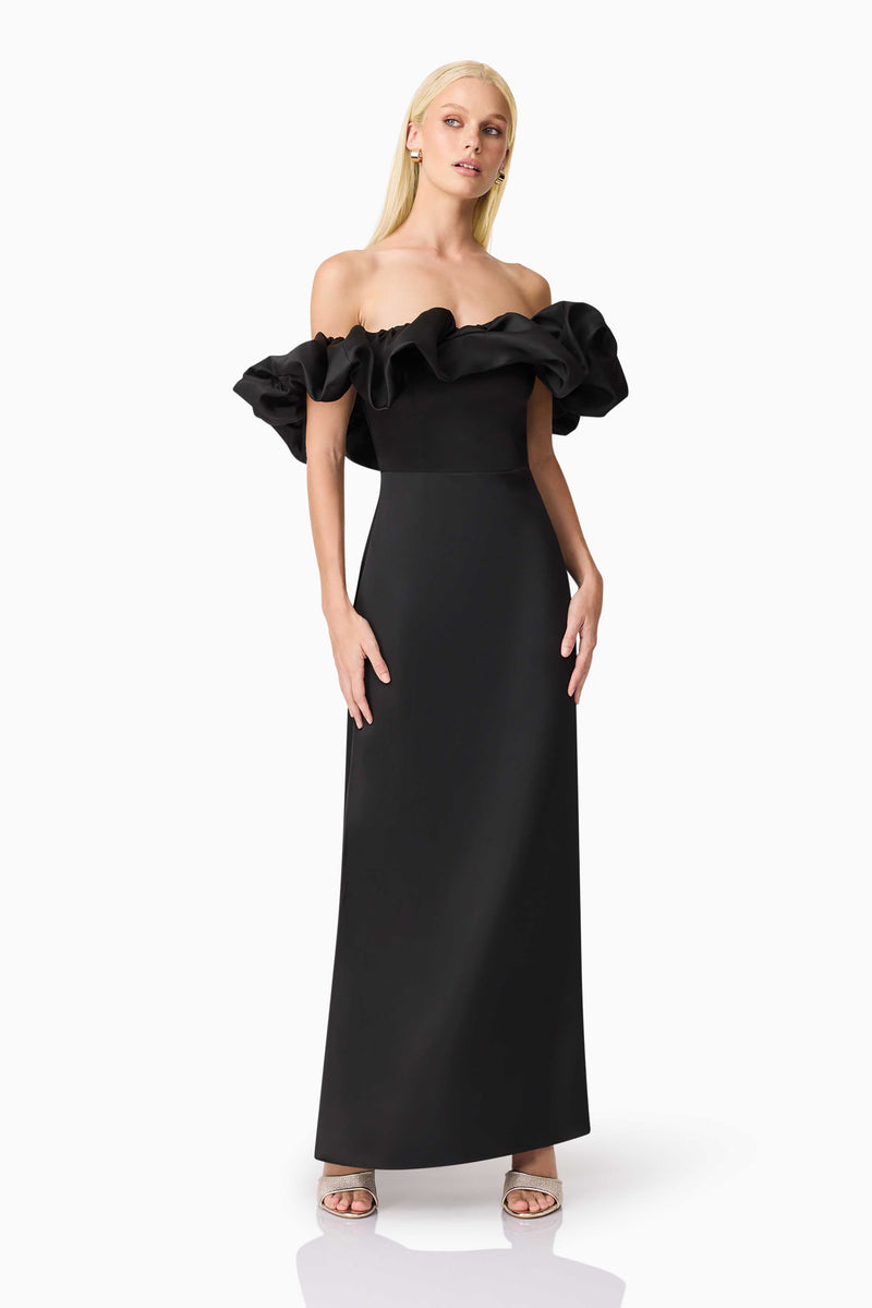Blonde model wearing Sharon Off The Shoulder Midi Dress in Black posed shot